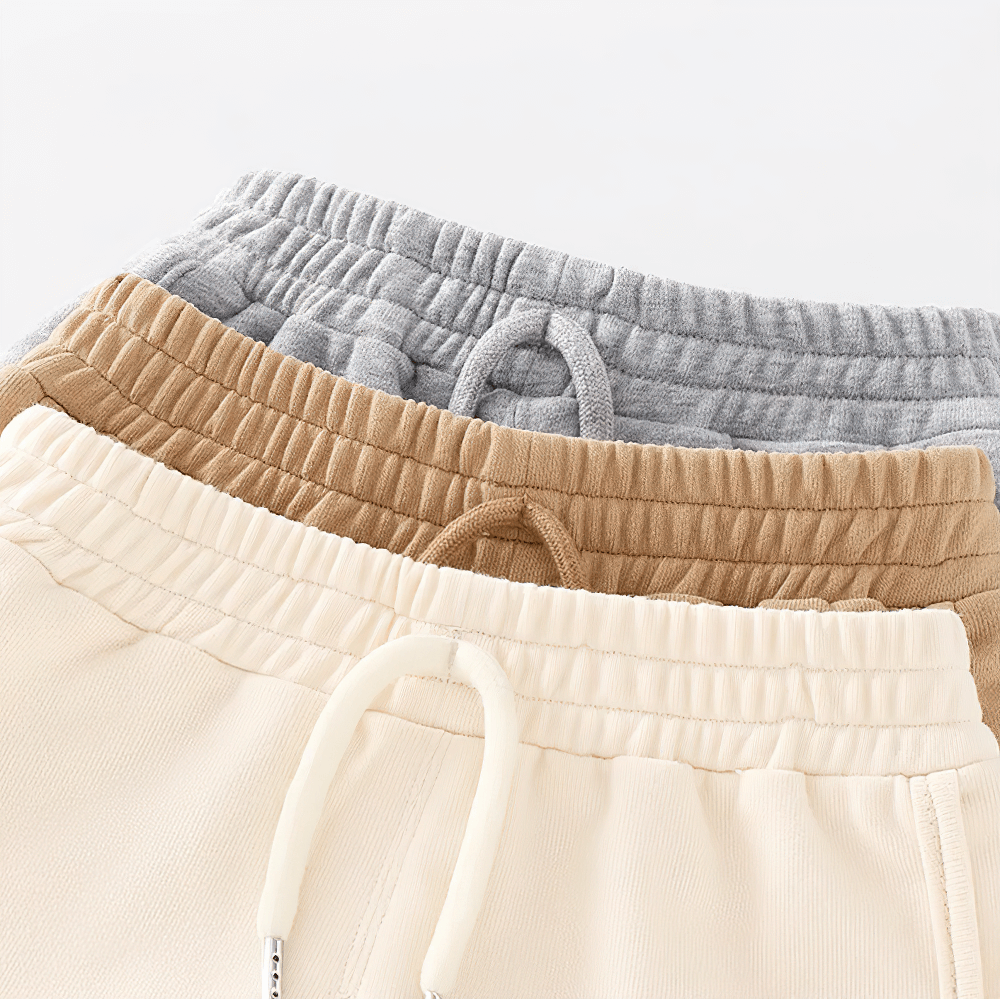 Stack of Kids Drawstring Shorts with Fun Animal Designs - SF3821 in beige, brown, and gray. Casual shorts with elastic waist and drawstring.