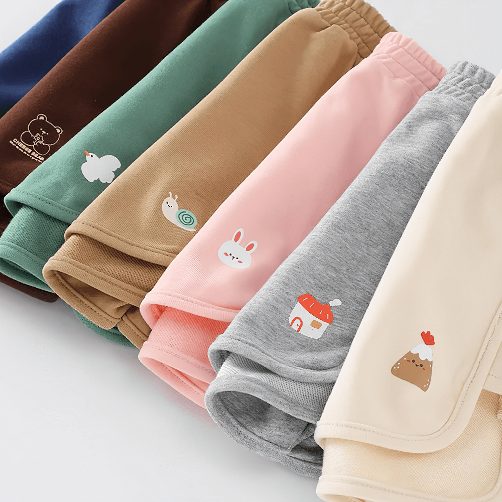 Colorful Kids Drawstring Shorts with Fun Animal Designs - SF3821 featuring bear, tree, volcano, and more on assorted pastel colors.