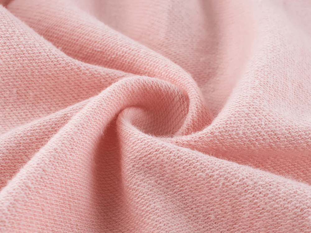 Close-up of soft pink knit fabric used in Kids Drawstring Shorts with Pockets and Buttons - SF3791, highlighting texture and quality.