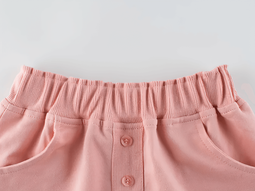 Close-up of Kids Drawstring Shorts with Pockets and Buttons - SF3791 in pink, featuring a stretchy waistband and button details.
