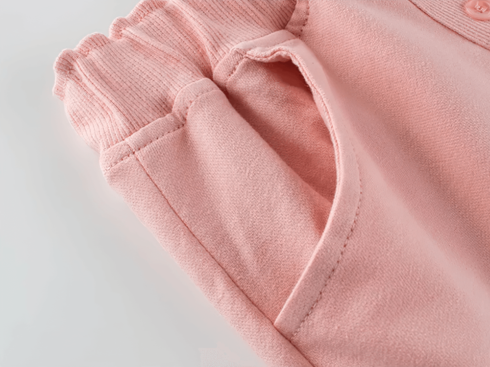 Close-up of Kids Drawstring Shorts with Pockets and Buttons - SF3791 showing soft knit fabric and pocket detail in pink.