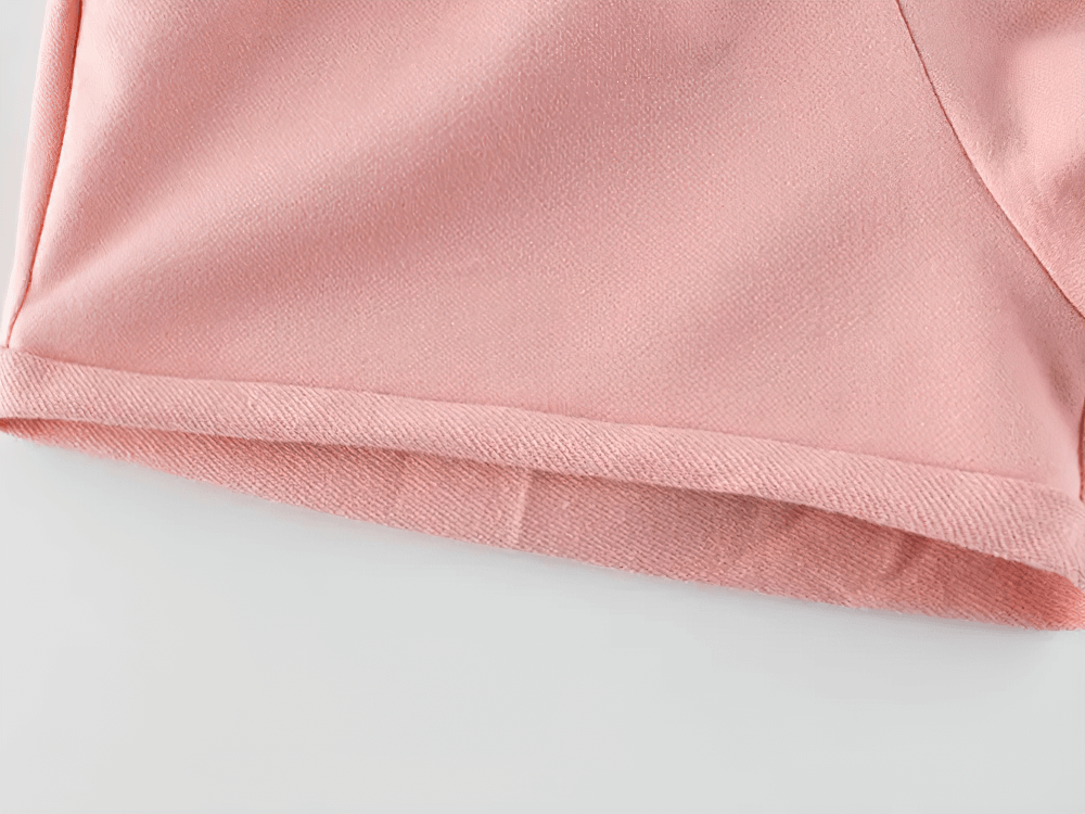 Close-up of pink Kids Drawstring Shorts with Pockets and Buttons - SF3791, showing the casual design and soft knit fabric.