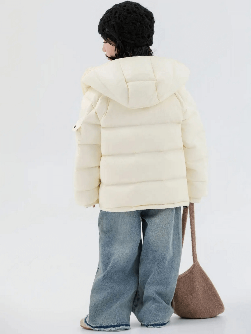 Rear view of girl wearing Kids Duck Down Jacket with Hood and Zipper - SF3515, showing windproof hood and stylish winter attire.