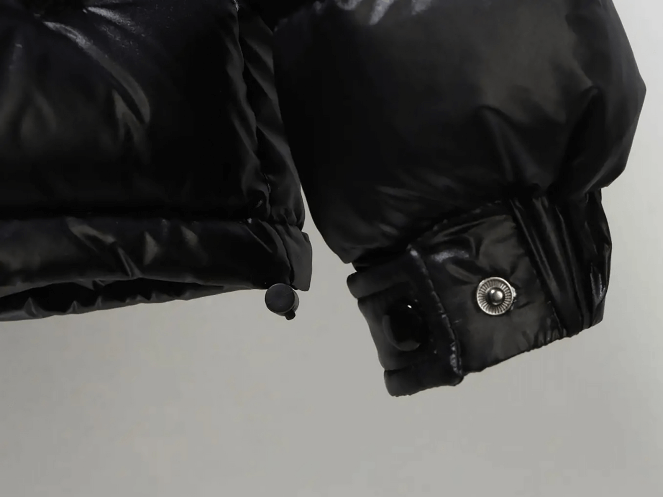 Close-up of cuff on Kids Duck Down Jacket with Hood and Zipper - SF3515, showing durable design and button detail.