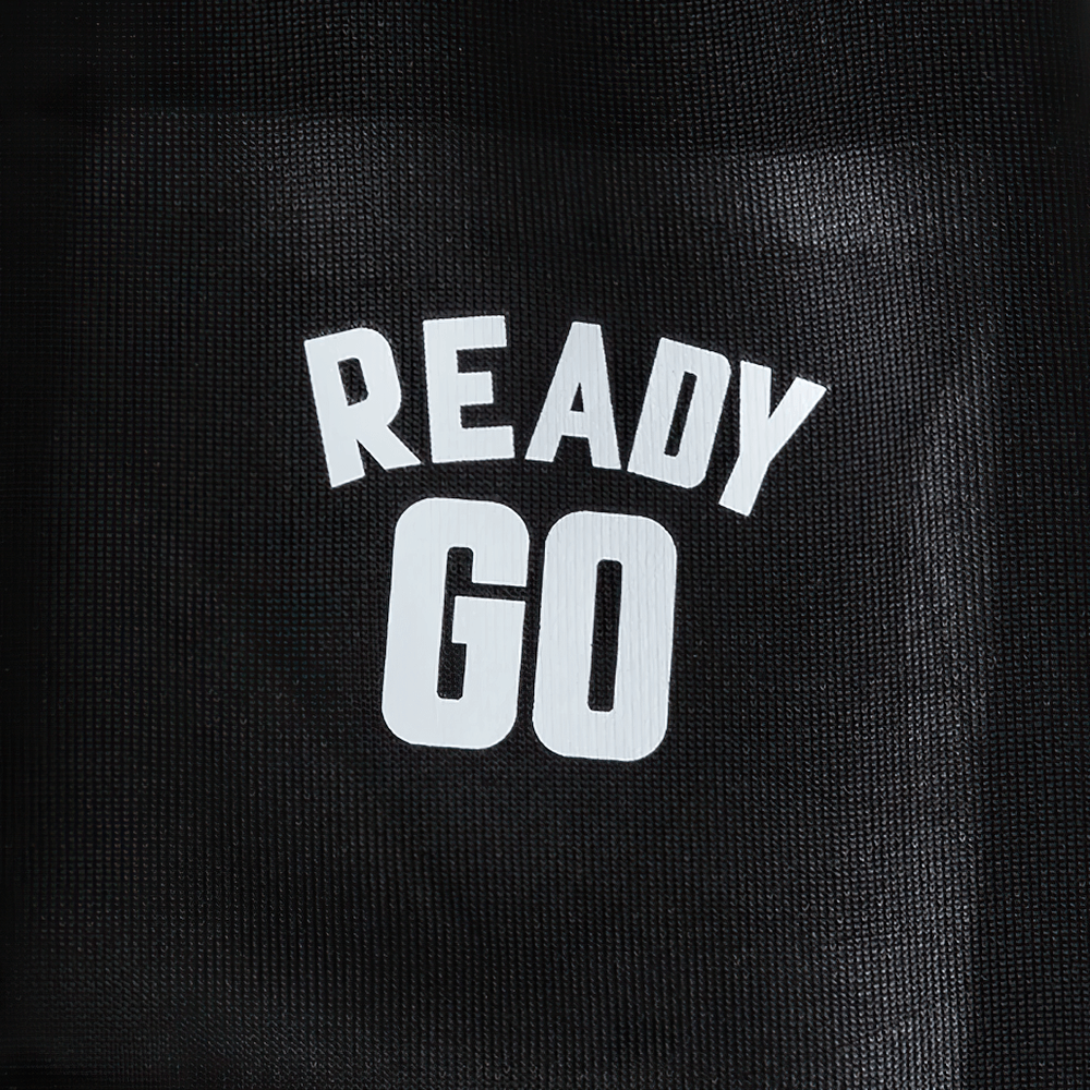Close-up of 'Ready Go' print on Kids Elastic Ankle Sport Pants Ready Go Print - SF3880, showcasing sporty design on black fabric.