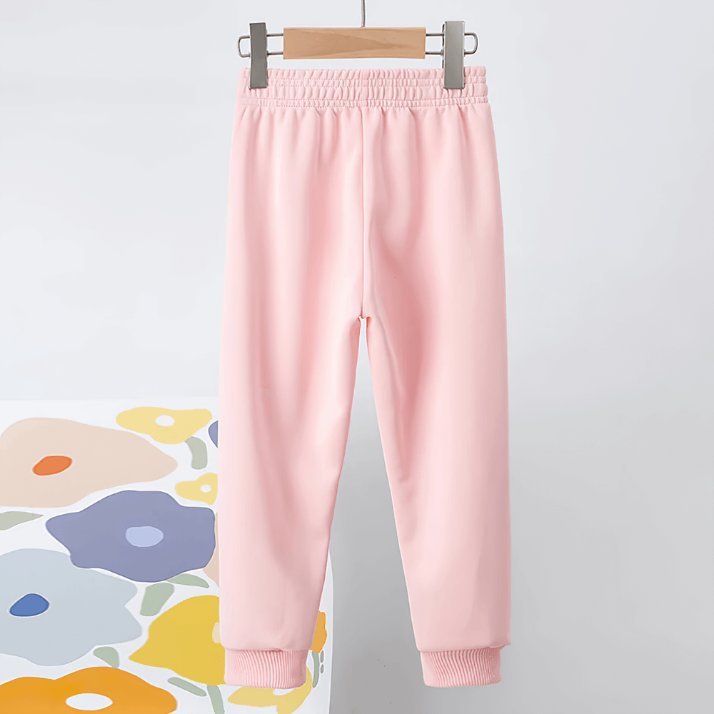 Kids Elastic Ankle Sport Pants Ready Go Print - SF3880 in pink displayed on a hanger, featuring ribbed cuffs and elastic waist.