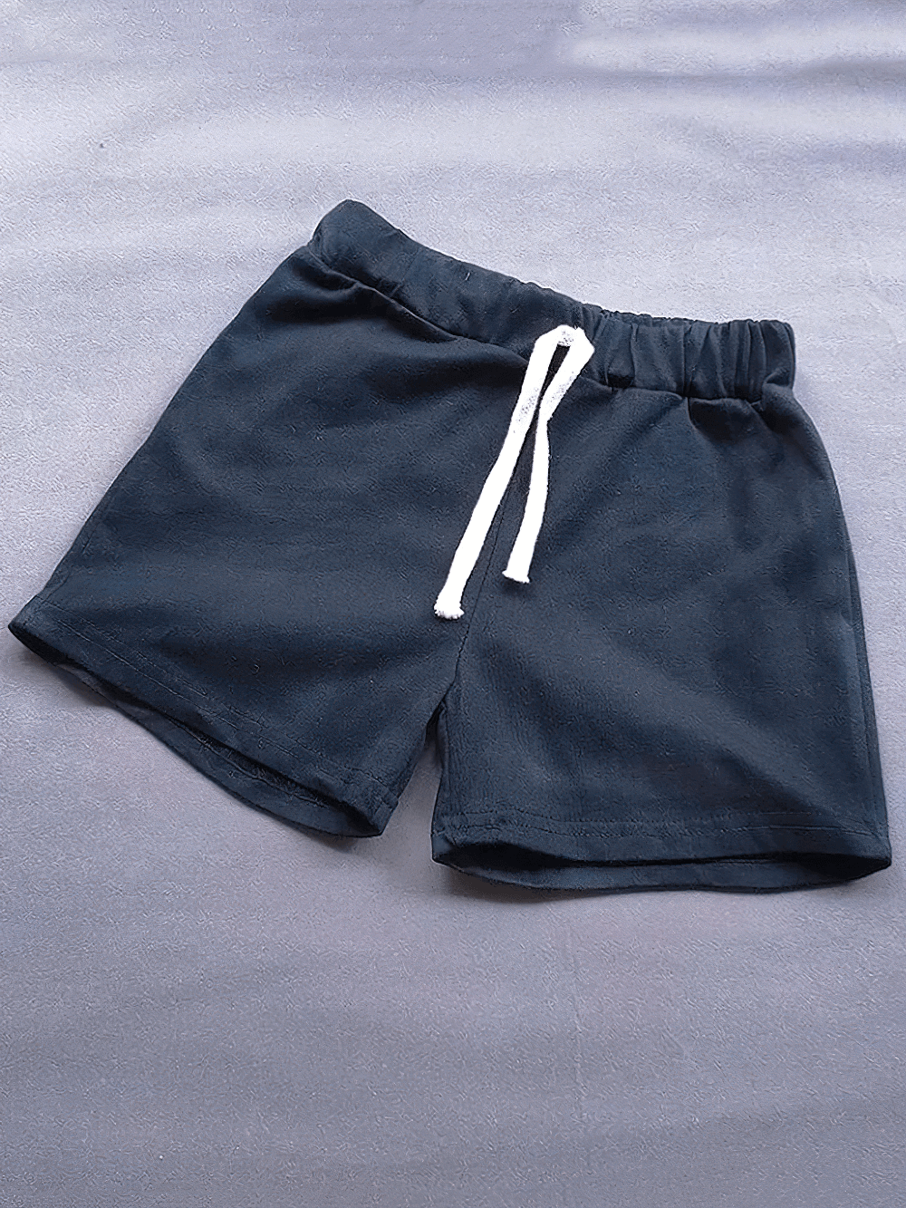 Kids Elastic Waist Cotton Shorts in Bright Colors - SF3767 on a flat surface, featuring a breathable design.