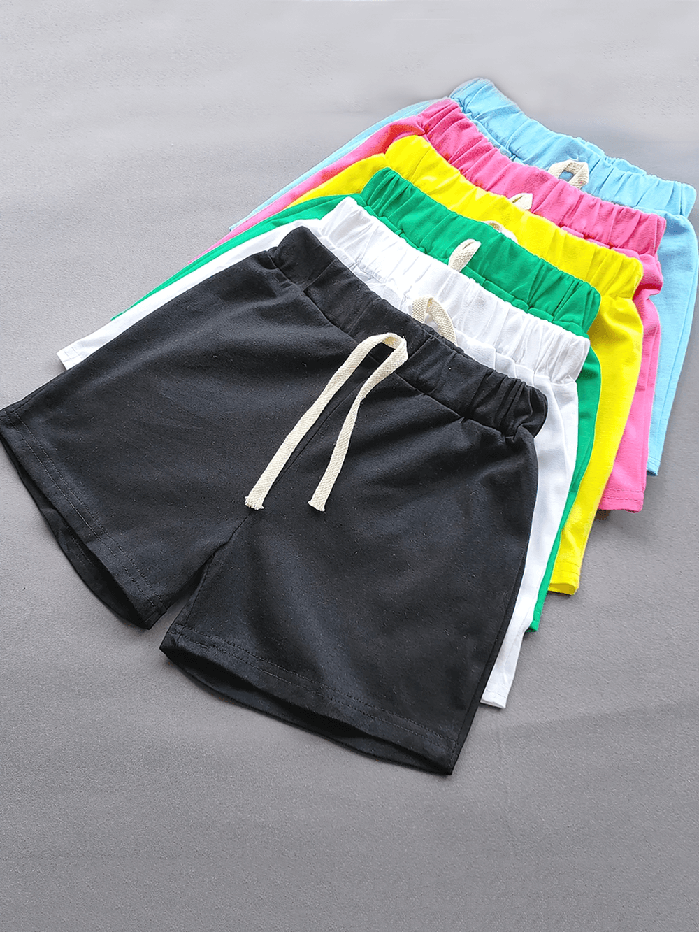 Stack of Kids Elastic Waist Cotton Shorts in Bright Colors - SF3767 on gray background