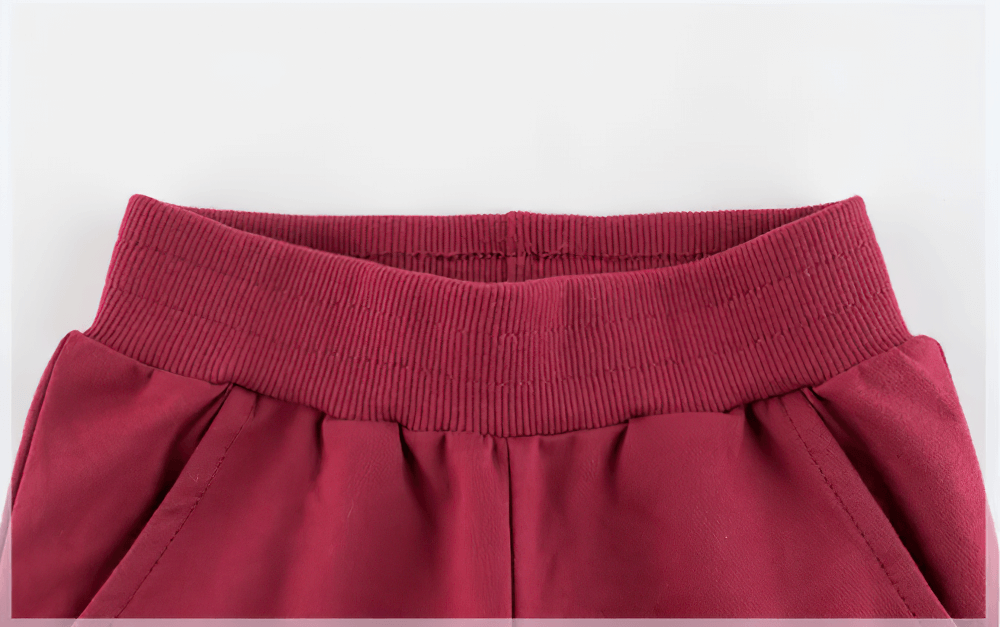 Close-up of Kids Elastic Waist Jogger Pants for Sport - SF3890 showcasing the elastic waistband in maroon.