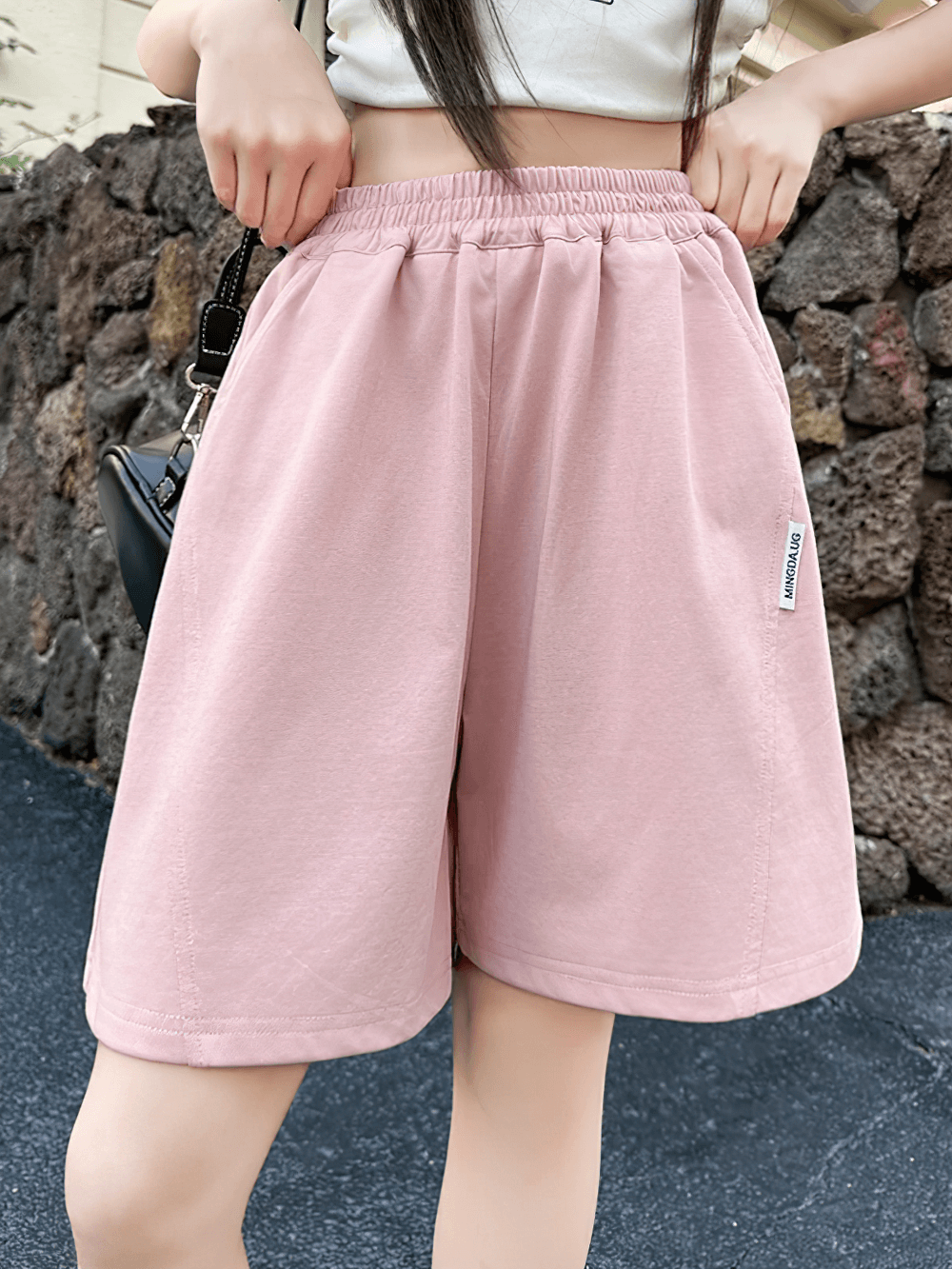 Kids Elastic Waist Loose Shorts with Pockets - SF3870 in pink, shown outdoors on a sunny day, perfect for play and casual outfits.