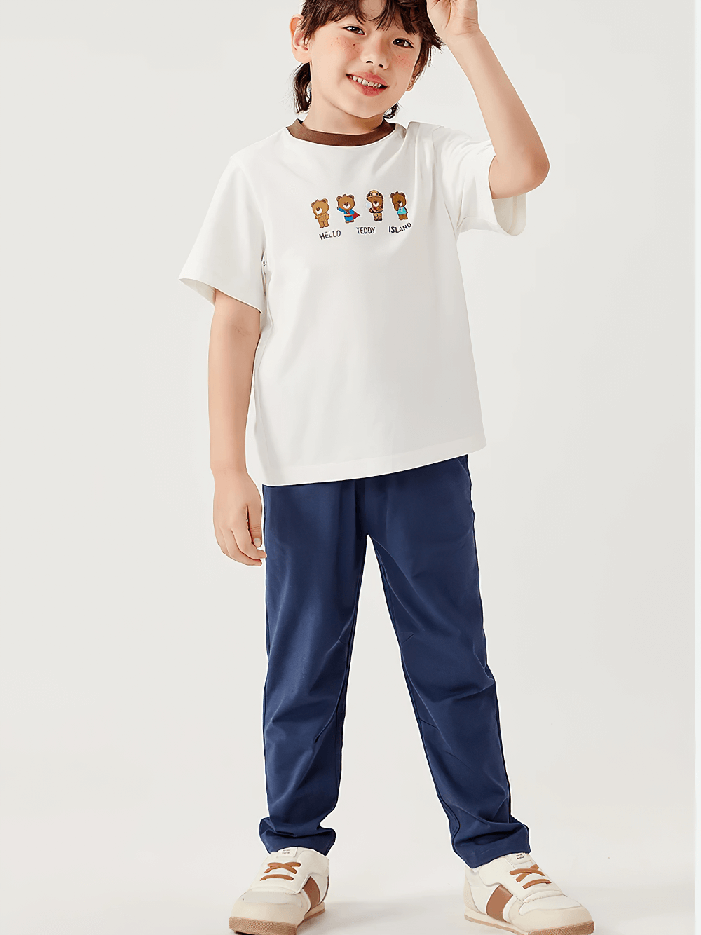 Child wearing Kids Elastic Waist Soft Cotton Sport Pants - SF3800 in blue, ideal for active play, featuring a straight-leg cut for boys and girls.