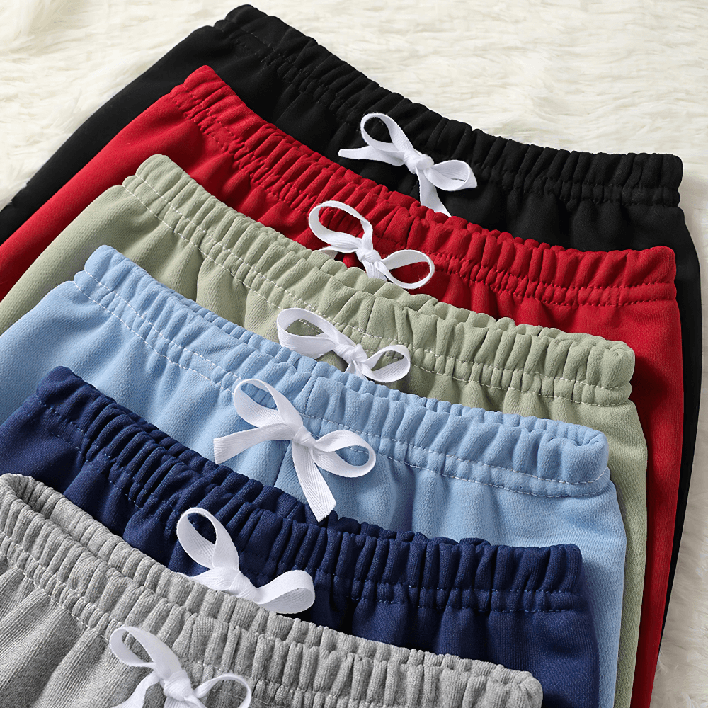 Kids Elastic Waist Sport Jogger Pants Multi Color - SF3861 in various colors with elastic waistbands showcased in a stack on a soft background.