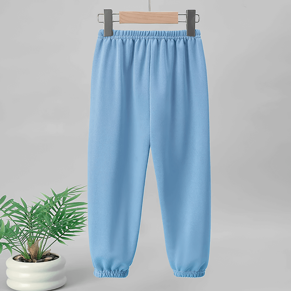 Blue Kids Elastic Waist Sport Jogger Pants Multi Color - SF3861 with elastic waistband hanging on a wooden hanger beside a potted plant