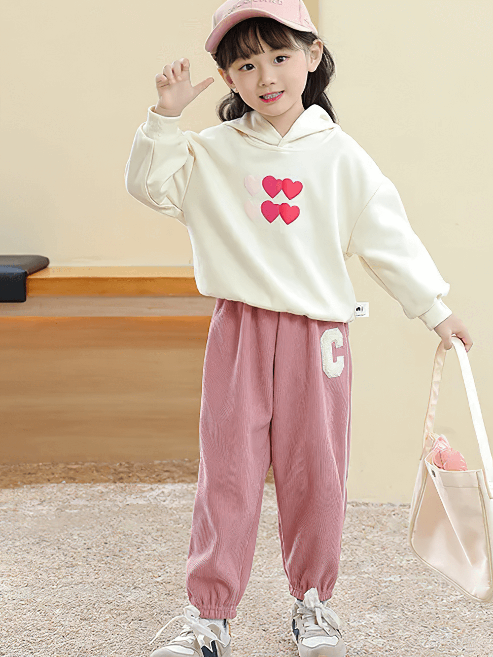 Child wearing pink Kids Fleece-Lined Sweatpants with Side Stripe - SF3717, paired with a heart print hoodie for a stylish look.