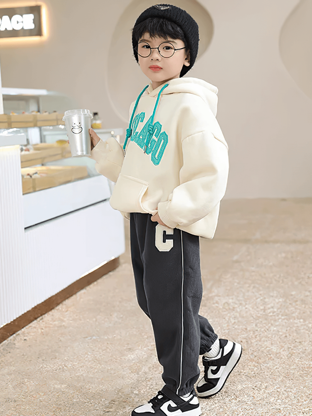 Child wearing Kids Fleece-Lined Sweatpants with Side Stripe - SF3717, featuring sporty design and elastic waist for warmth and comfort.