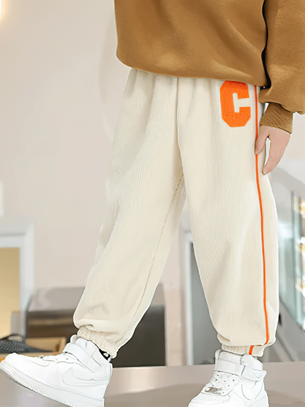 Kids Fleece-Lined Sweatpants with Side Stripe - SF3717 in beige with orange side stripe, featuring elastic waist and sporty design.
