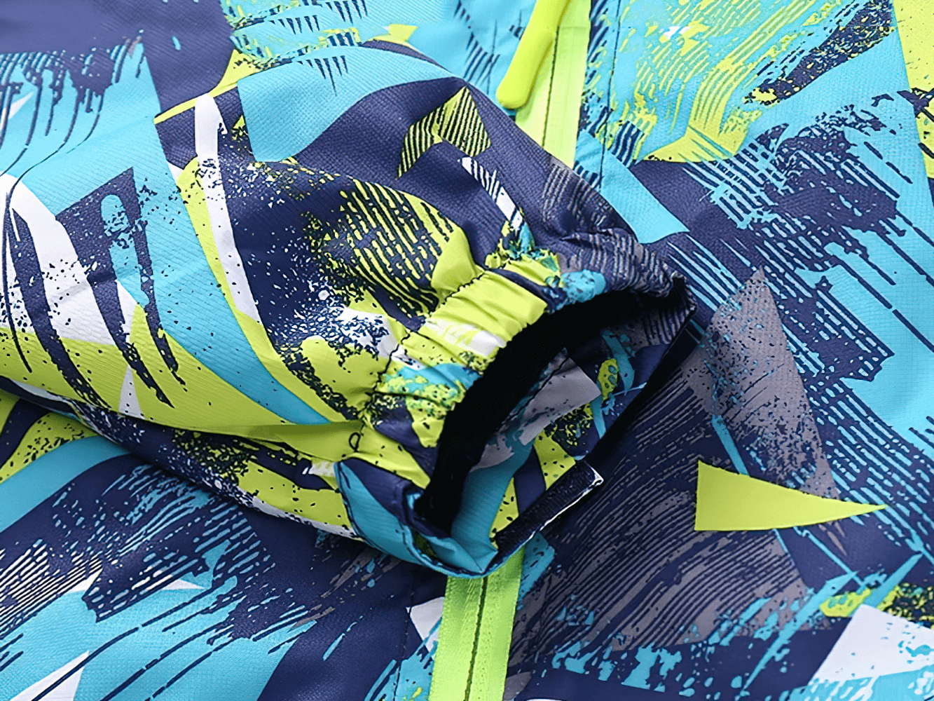 Vibrant color detail of Kids Fleece Lining Zip Up Hooded Rain Jacket - SF3604 showcasing windbreaker fabric with colorful pattern.