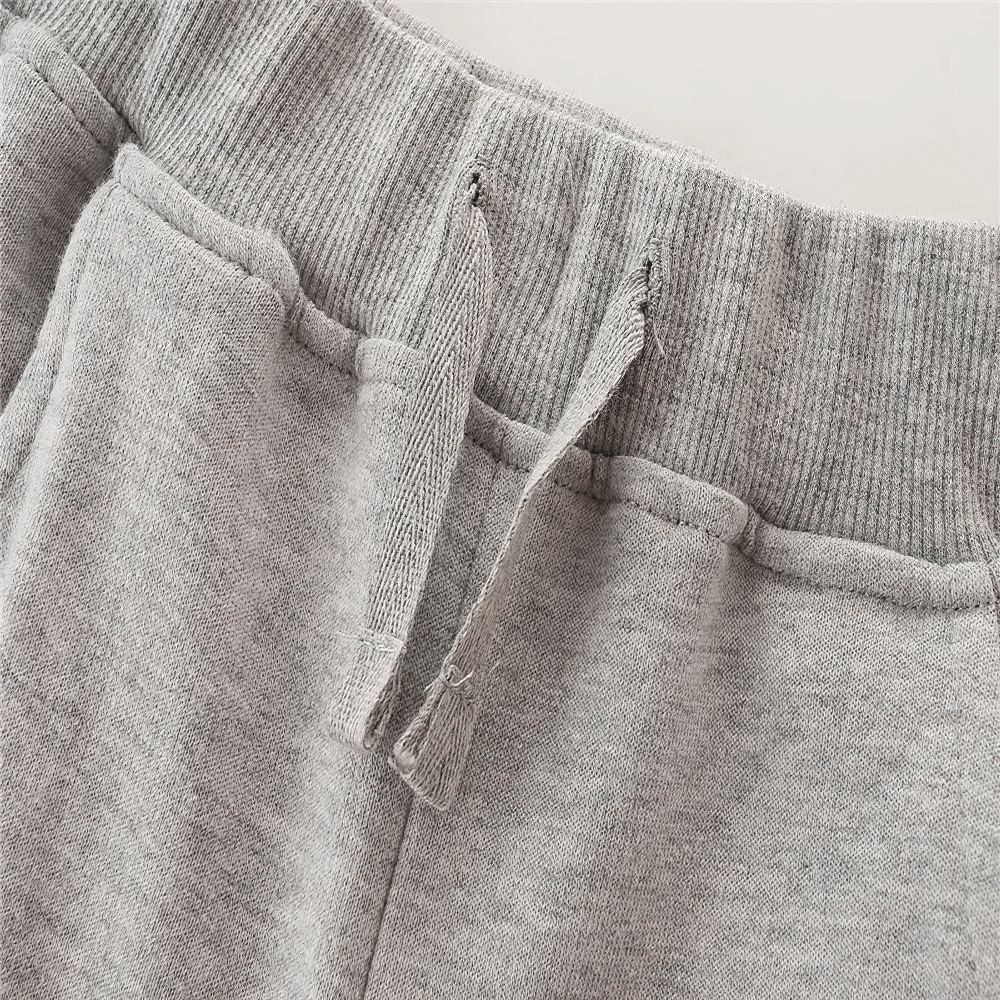 Close-up of Kids Fleece Pants with Drawstring and Rib Cuffs - SF3811 showcasing the elastic waist and side pockets for comfort and style.