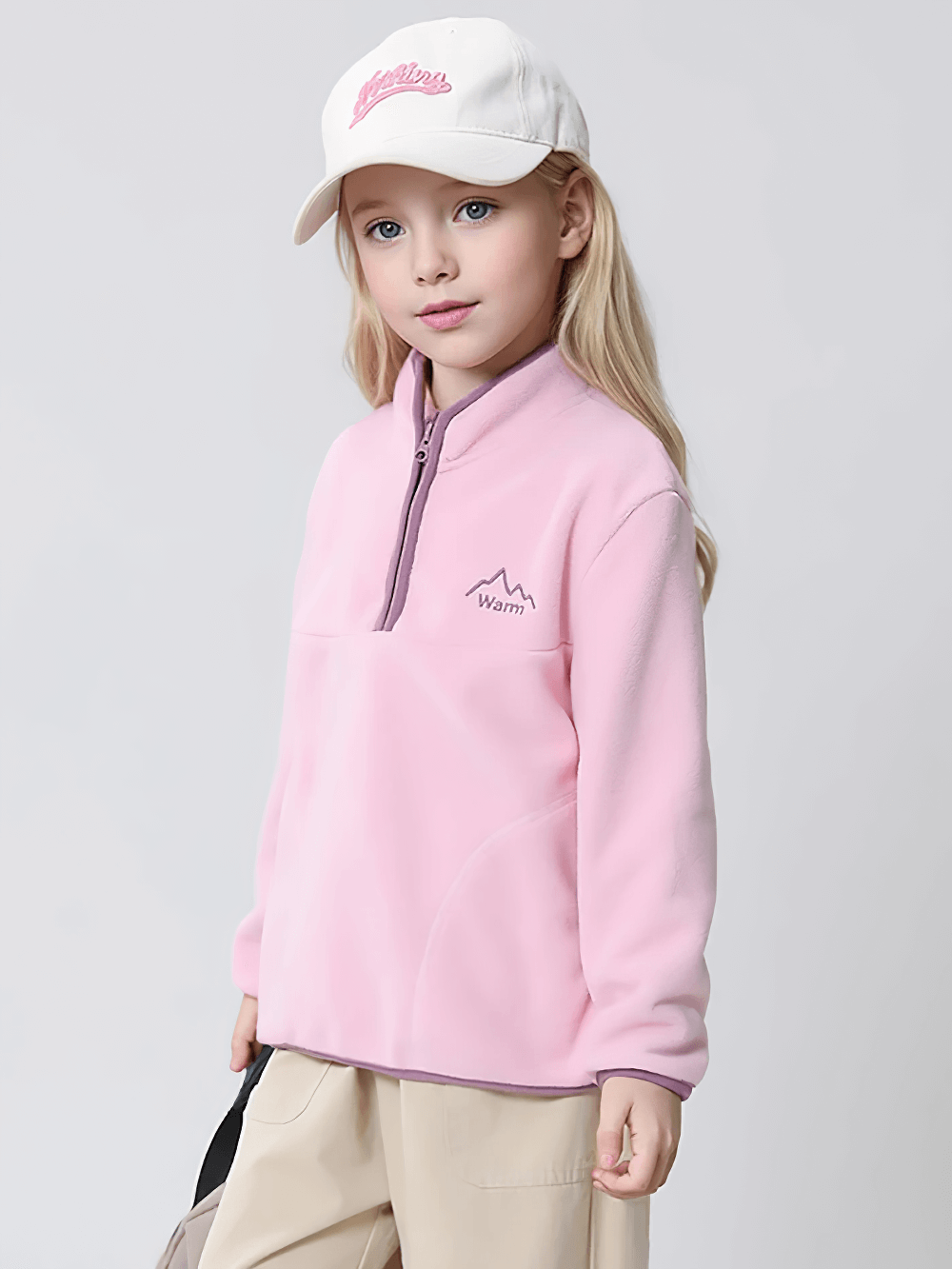 Child wearing pink Kids Fleece Sweatshirt with Half Zip Polckets - SF3578, featuring cozy stand collar and casual color block design for cool weather.