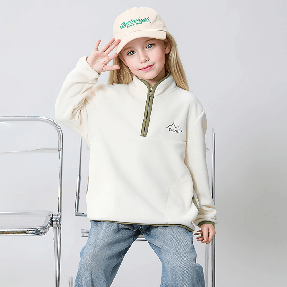 Child wearing Kids Fleece Sweatshirt with Half Zip Polckets - SF3578 in a stylish color block pattern, perfect for cool weather fun.