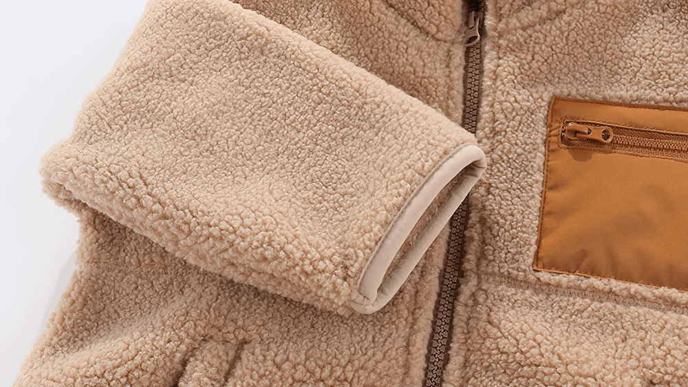 Close-up of Kids Fleece Zip Jacket with Contrast Pocket Design - SF3509, showcasing warm sherpa texture and stylish chest pocket.