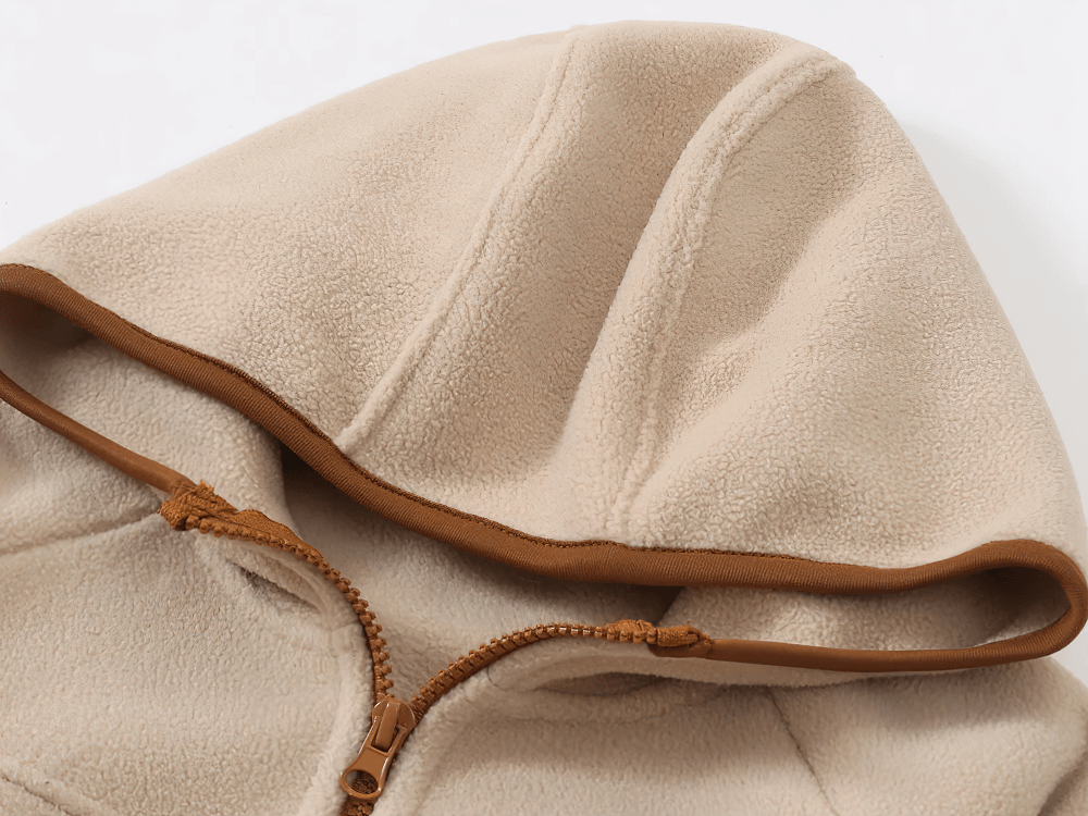 Hood detail of Kids Fleece Zip-Up Jacket with Contrast Trim - SF3828 in beige with brown trim, showcasing cozy fleece material.