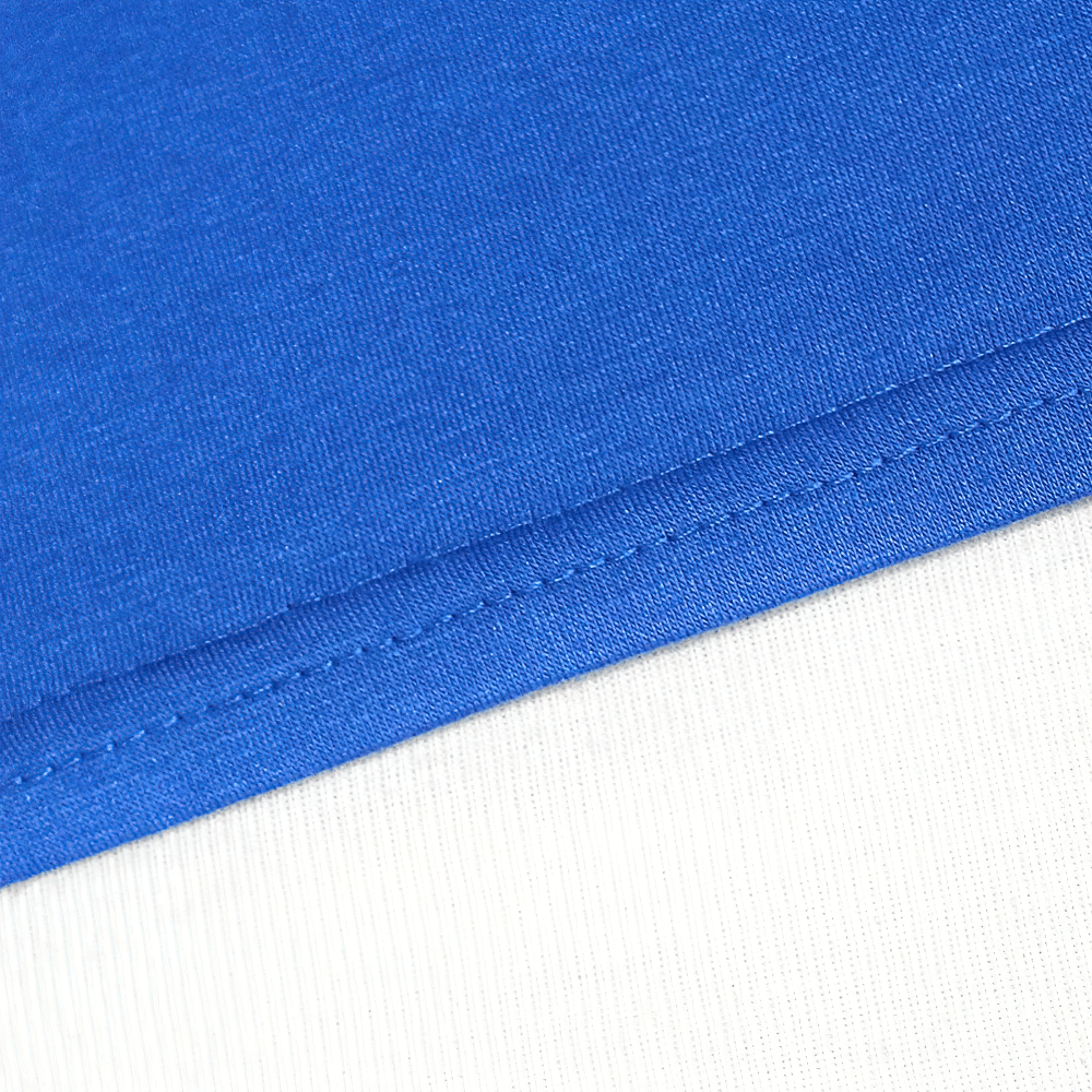 Close-up of kids' football print cotton T-shirt in blue showing fabric texture and seam details, ideal for sports and play.