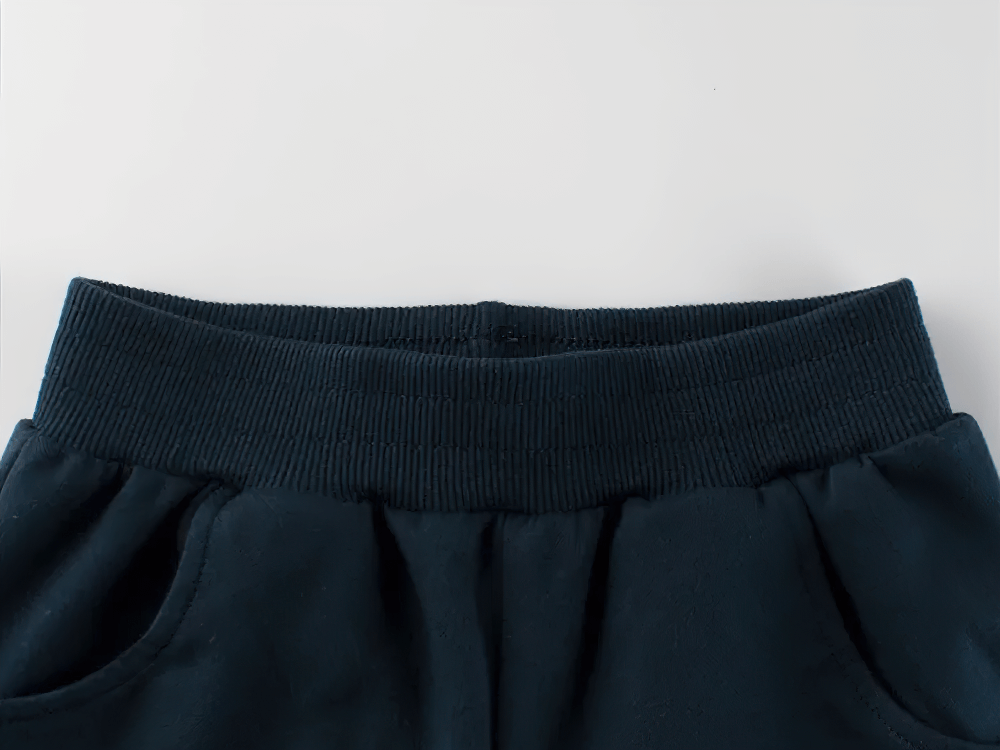 Close-up of Kids G1 Graphic Knit Shorts with Elastic Waistband - SF3785, showing top knit fabric and side pockets