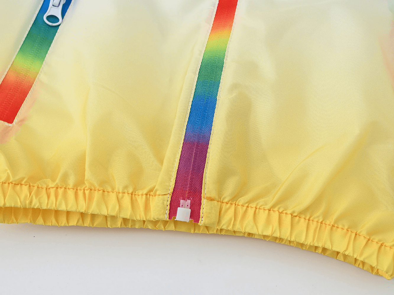 Close-up of Kids Gradient Hooded Windbreaker with Zipper - SF3652 showing colorful zipper and elastic cuffs.