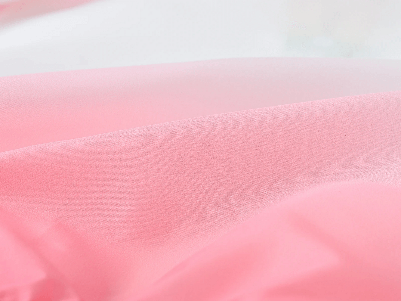 Close-up of the Kids Gradient Hooded Windbreaker with Zipper - SF3652 fabric in pink and white ombre texture reflecting sunlight.