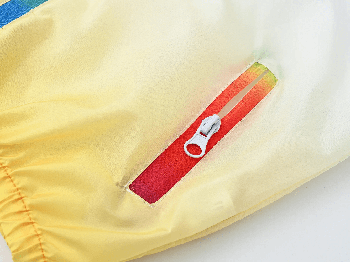 Close-up of Kids Gradient Hooded Windbreaker with Zipper - SF3652 showing colorful gradient zipper detail.