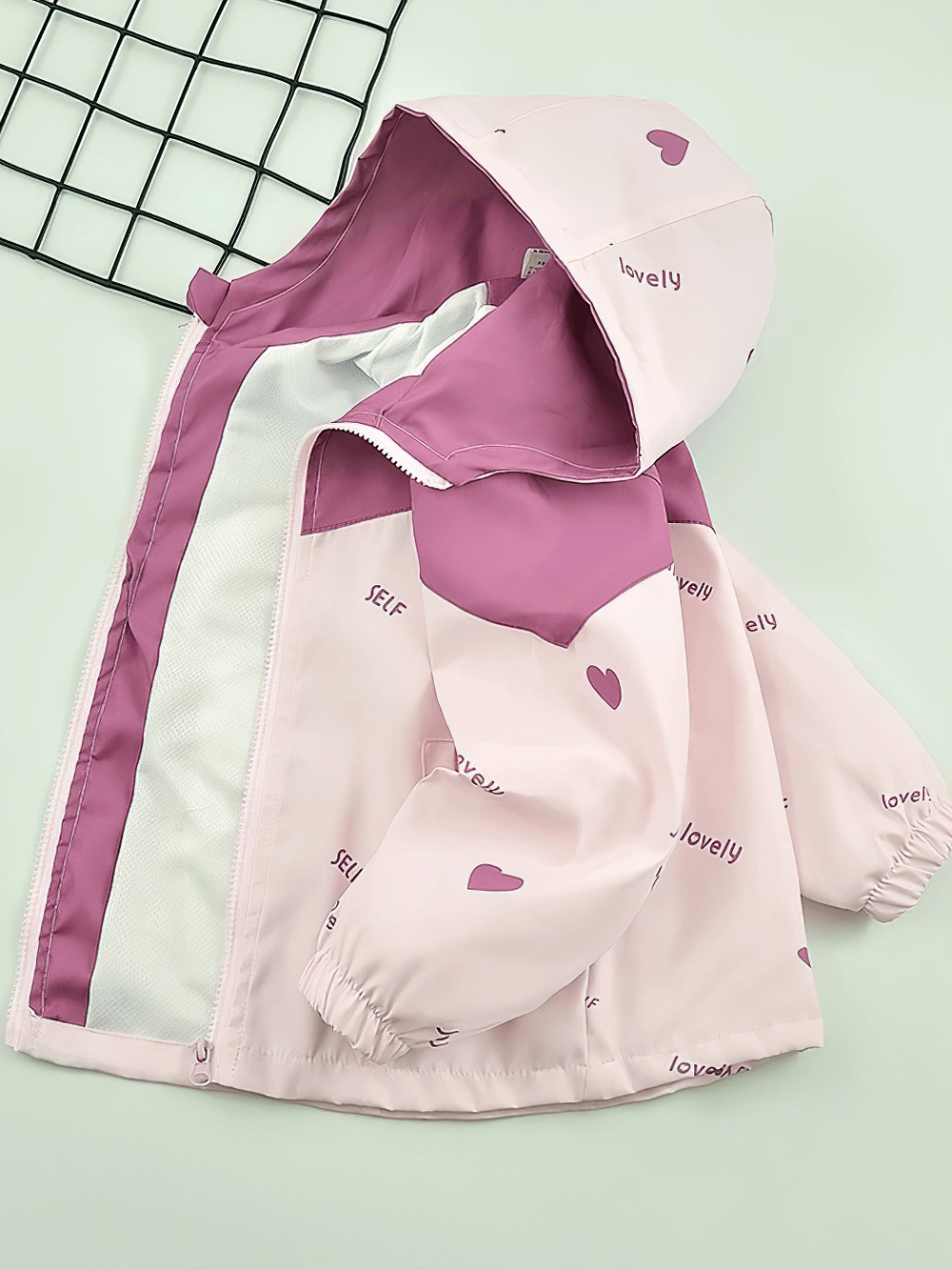 Kid's Heart Print Hooded Windbreaker Jacket - SF3680 in soft pink with heart design, long sleeves, elastic cuffs, and zip closure.