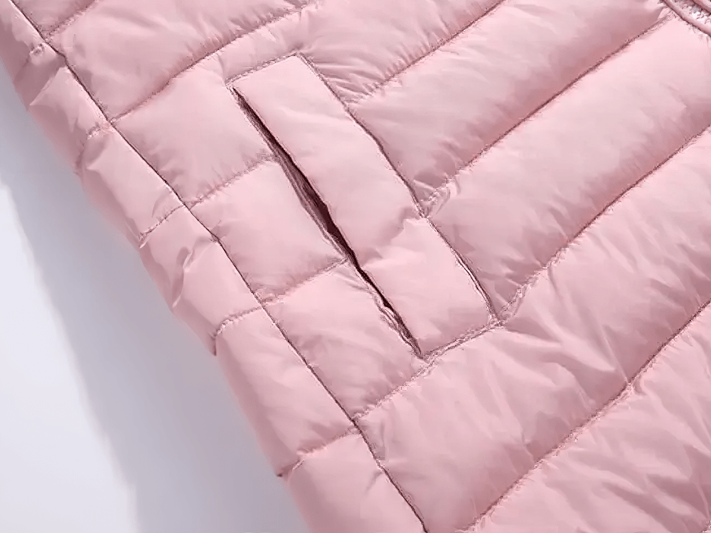 Close-up of pink Kids Hooded Cotton-Padded Long Warm Coat - SF3698, showcasing quilted fabric and pocket detail for cold weather.