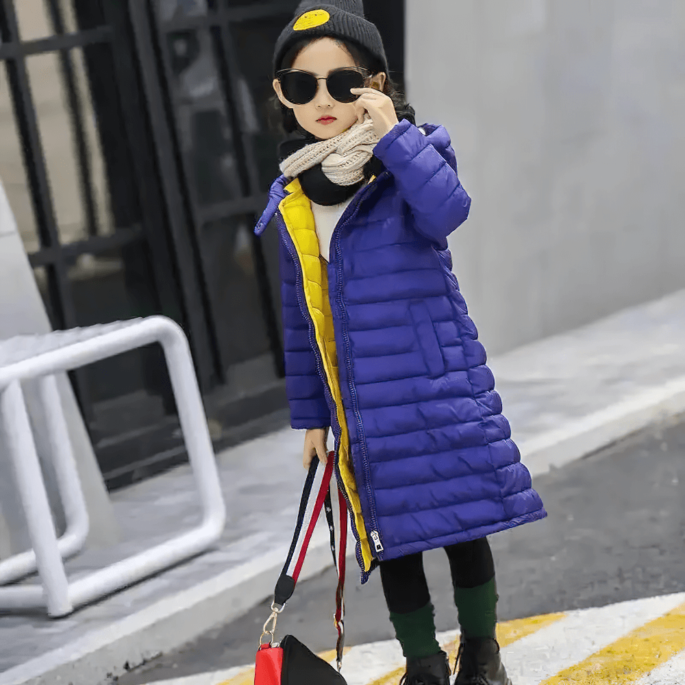 Child wearing a Kids Hooded Cotton-Padded Long Warm Coat - SF3698 in blue, ideal for winter, standing stylishly with sunglasses and a scarf.