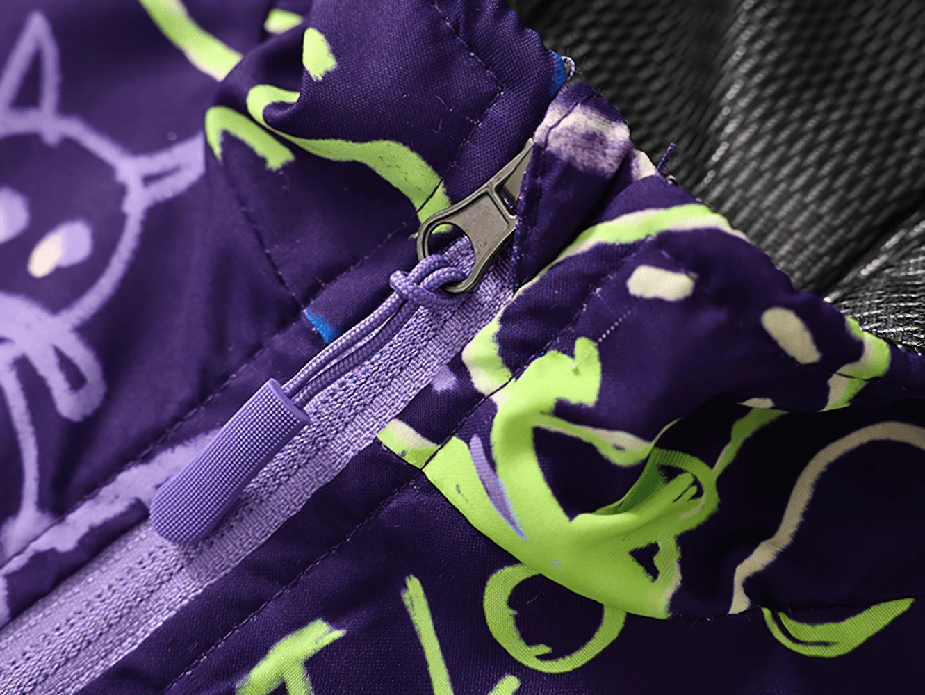Close-up of Kids Hooded Jacket with Colorful Graffiti Print - SF3606, highlighting unique purple and green graffiti on waterproof fabric.