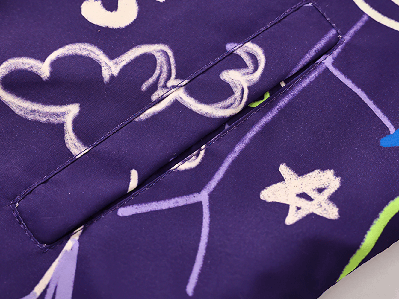 Close-up of Kids Hooded Jacket with Colorful Graffiti Print - SF3606 showing vibrant star and cloud designs on purple fabric.