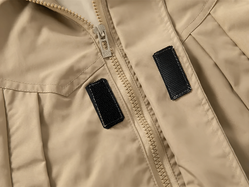 Detail of the beige Kid's Lightweight Hooded Windbreaker - SF3549 with zipper and black accents for versatile boys' and girls' outerwear.