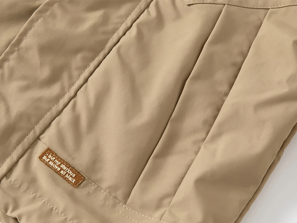 Close-up of Kid's Lightweight Hooded Windbreaker - SF3549 in beige color showing material texture and stitching details.