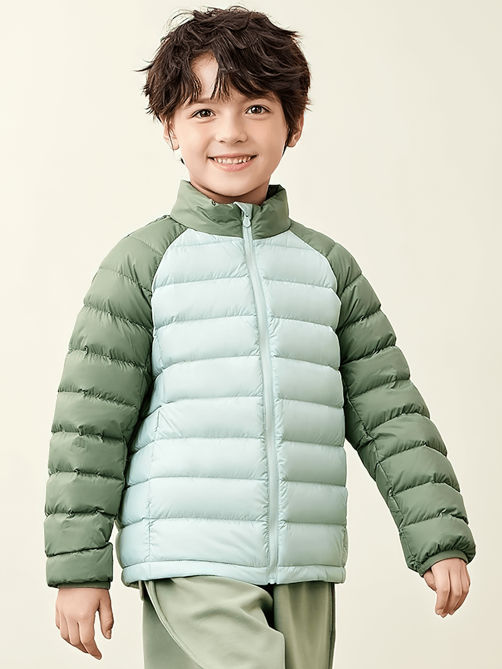 Smiling child wearing the Kids Lightweight Jacket with Warm Quilted Design - SF3702, featuring insulated quilted outerwear and raglan sleeves.