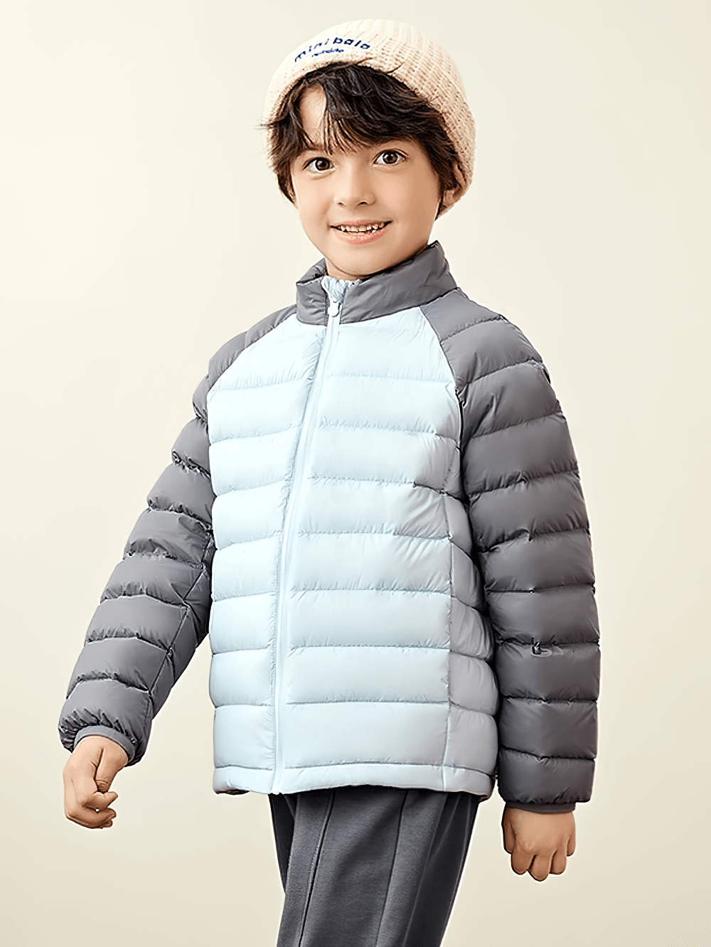Smiling child wearing Kids Lightweight Jacket with Warm Quilted Design - SF3702 in grey and blue hues, ideal for cold weather.