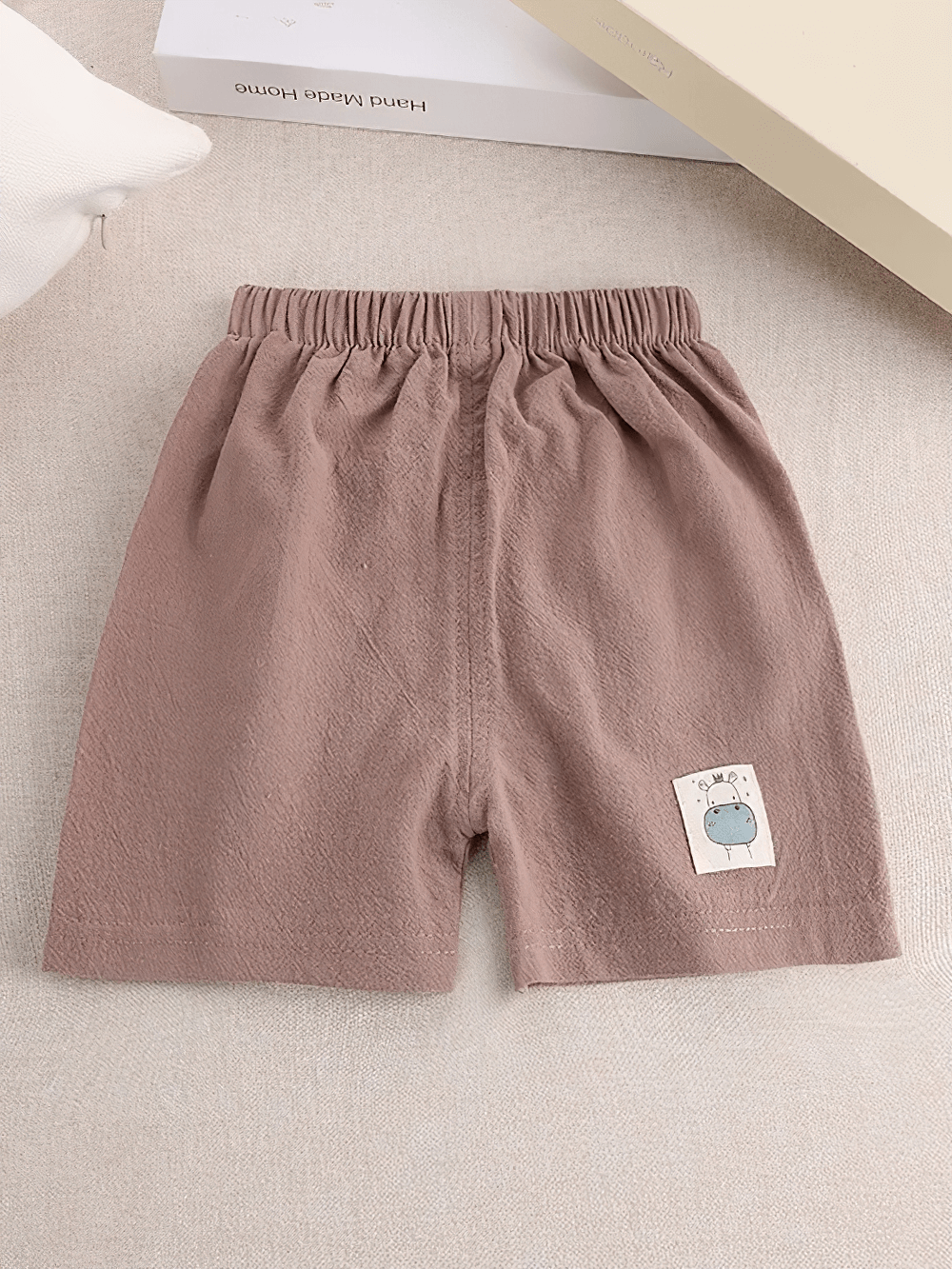 Kids Lightweight Shorts with Cute Patch Detail - SF3755 in brown with elastic waistband and adorable patch on one leg for a playful look.