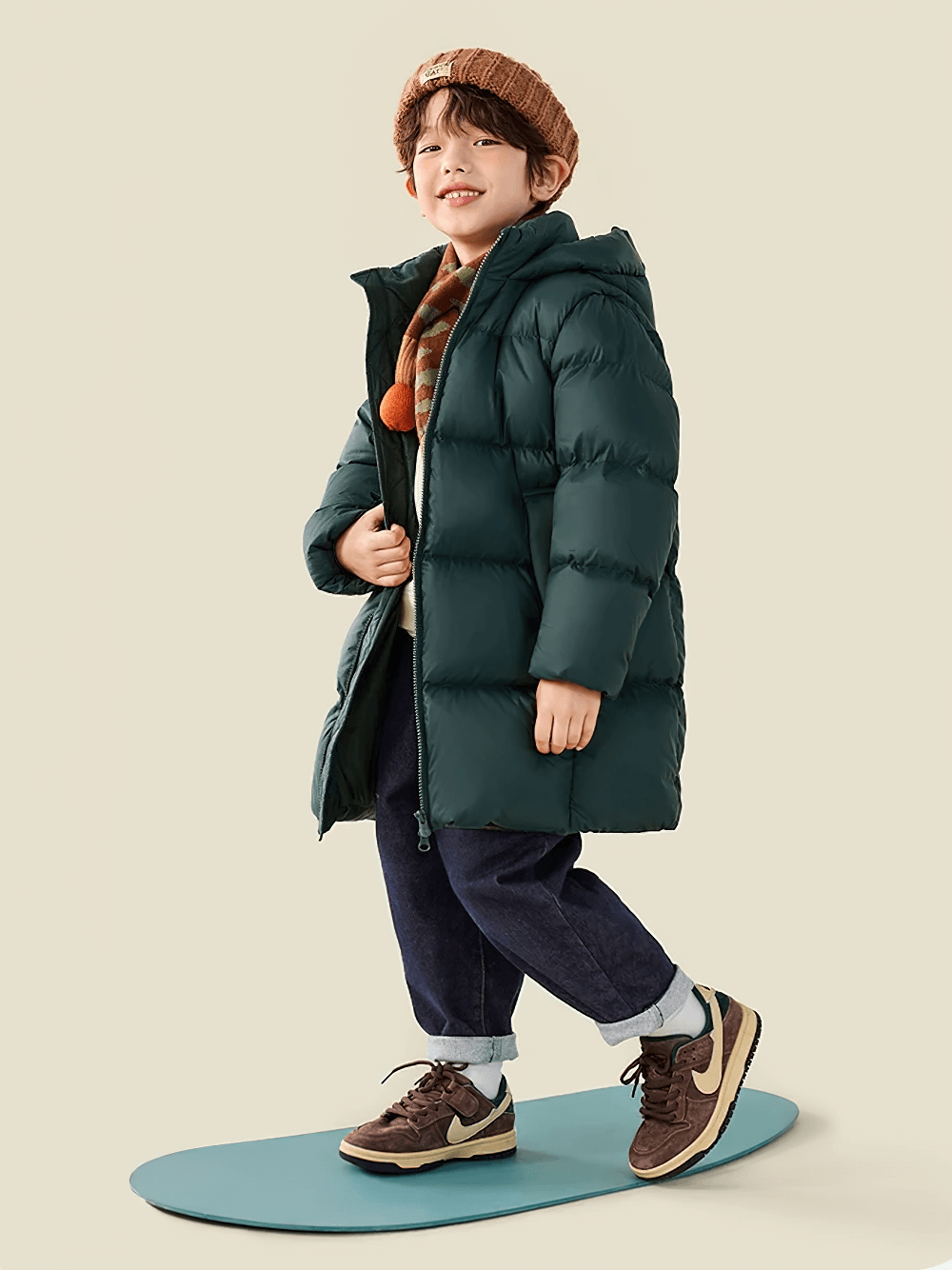 Child wearing Kids Long Down Parka with Hood and Windproof Design - SF3511, perfect for winter with warm insulation and waterproof fabric.