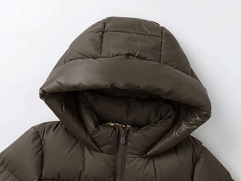 Close-up of Kids Long Down Parka with Hood and Windproof Design - SF3511, featuring a large hood and quilted, waterproof fabric.