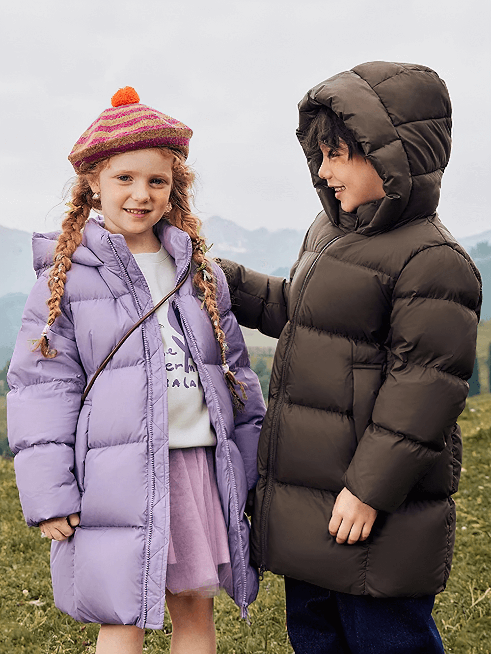 Kids wearing Kids Long Down Parka with Hood and Windproof Design - SF3511, playing outdoors in winter coats, smiling warmly.