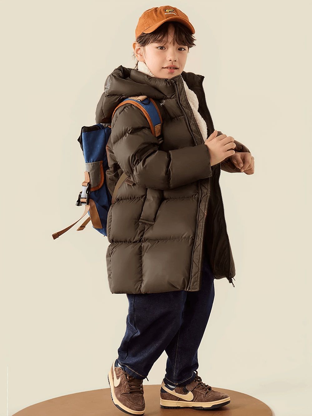 Child wearing Kids Long Down Parka with Hood and Windproof Design - SF3511, ready for winter adventures.