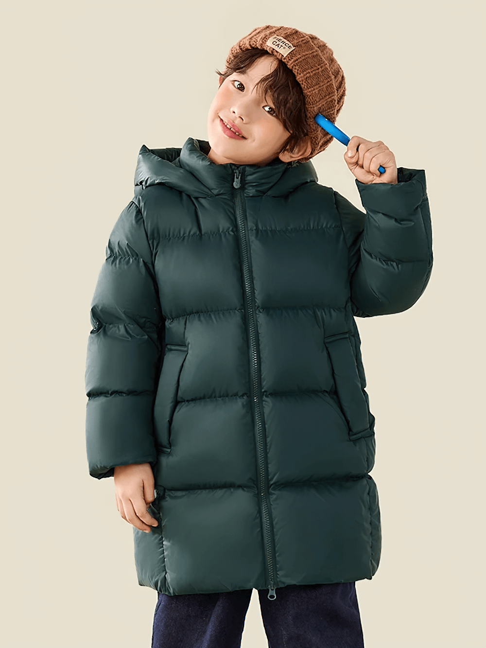 Child wearing a Kids Long Down Parka with Hood and Windproof Design - SF3511, winter coat in green, staying cozy and warm.
