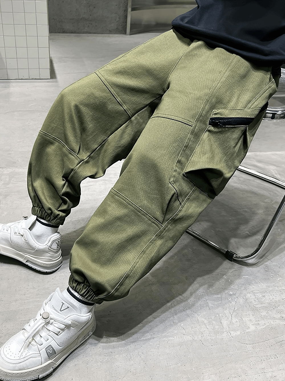 Kids Loose Cargo Jogger Pants with Zipper Pockets - SF3719 in green, featuring full-length legs and athletic sneakers on a modern cement floor.
