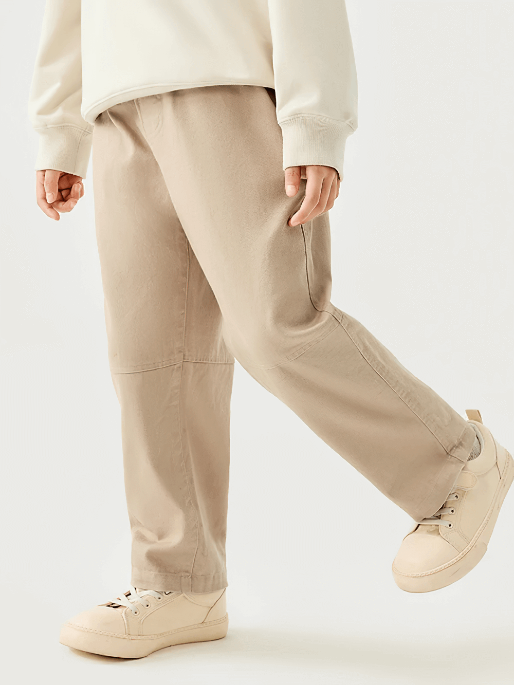 Child wearing Kids Loose Sport Trousers with Elastic Waist - SF3801, showcasing tan loose-fit pants with practical pockets for daily wear.