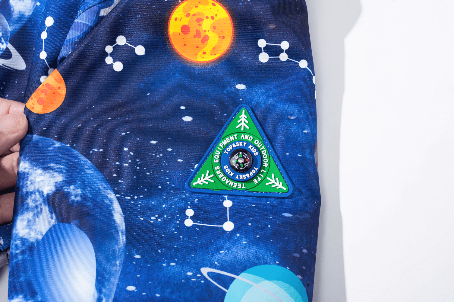 Vibrant space-themed fabric of Kids' Outer Space Waterproof Zip Hooded Jacket - SF3585 with planets and stars print.