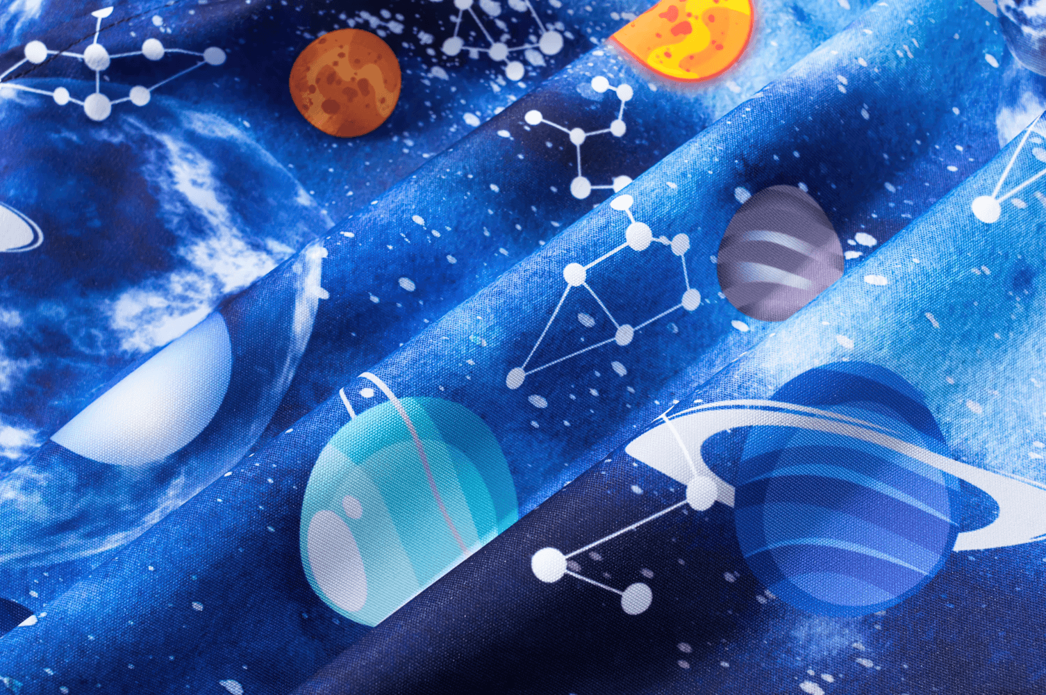 Close-up of space-themed fabric design on Kids' Outer Space Waterproof Zip Hooded Jacket - SF3585, featuring planets and constellations.